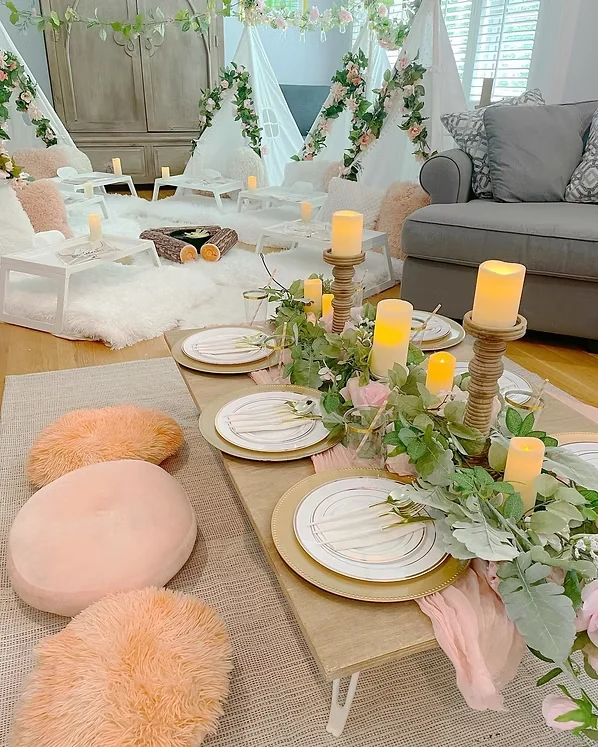 Floral teepee sleepover party setup by The Slumber Squad